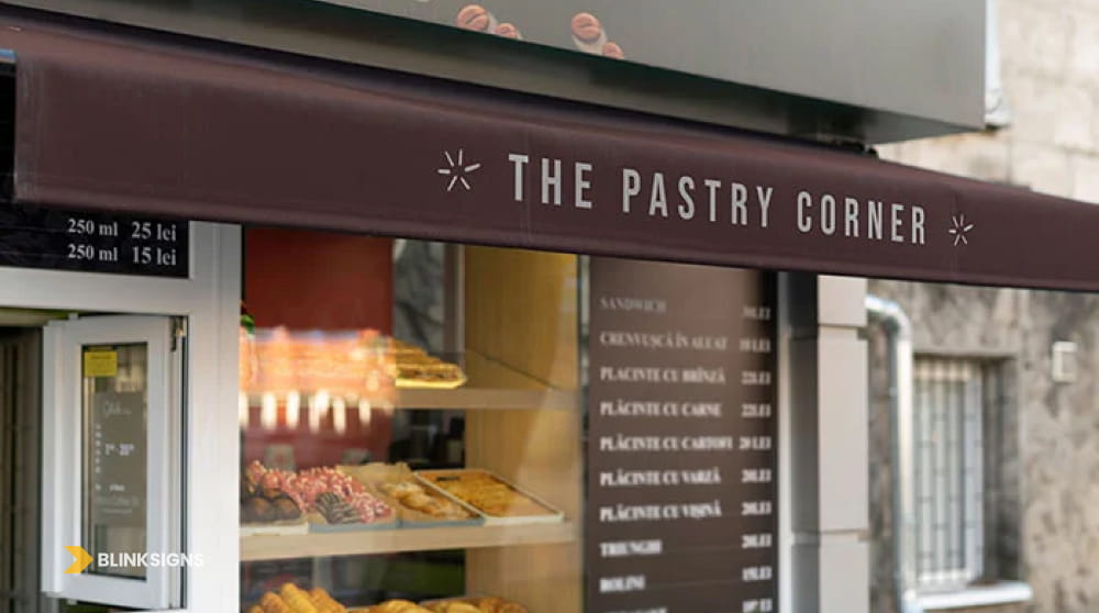 Commercial brown storefront awning valance with printed brand name for The Pastry Corner bakery.
