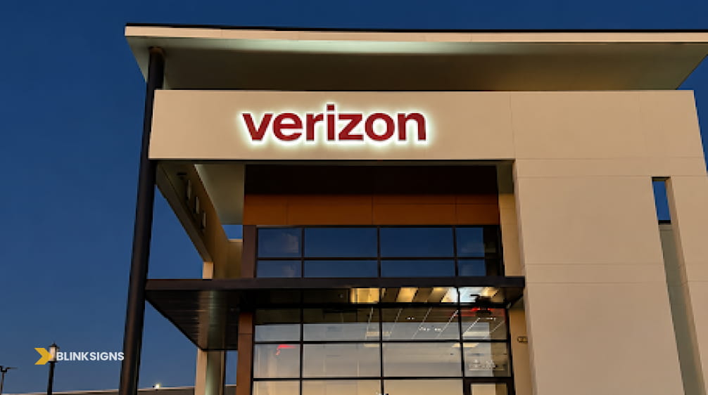 White halo lit Verizon channel letter storefront sign mounted on a modern commercial retail building facade.