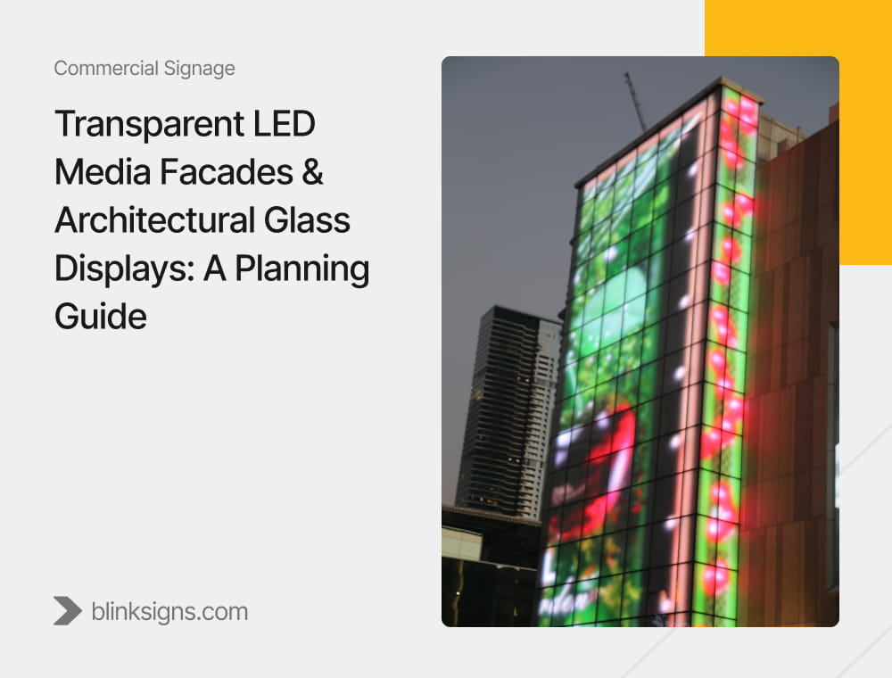 High rise building exterior glass wall featuring large scale colorful illuminated transparent LED media facade.