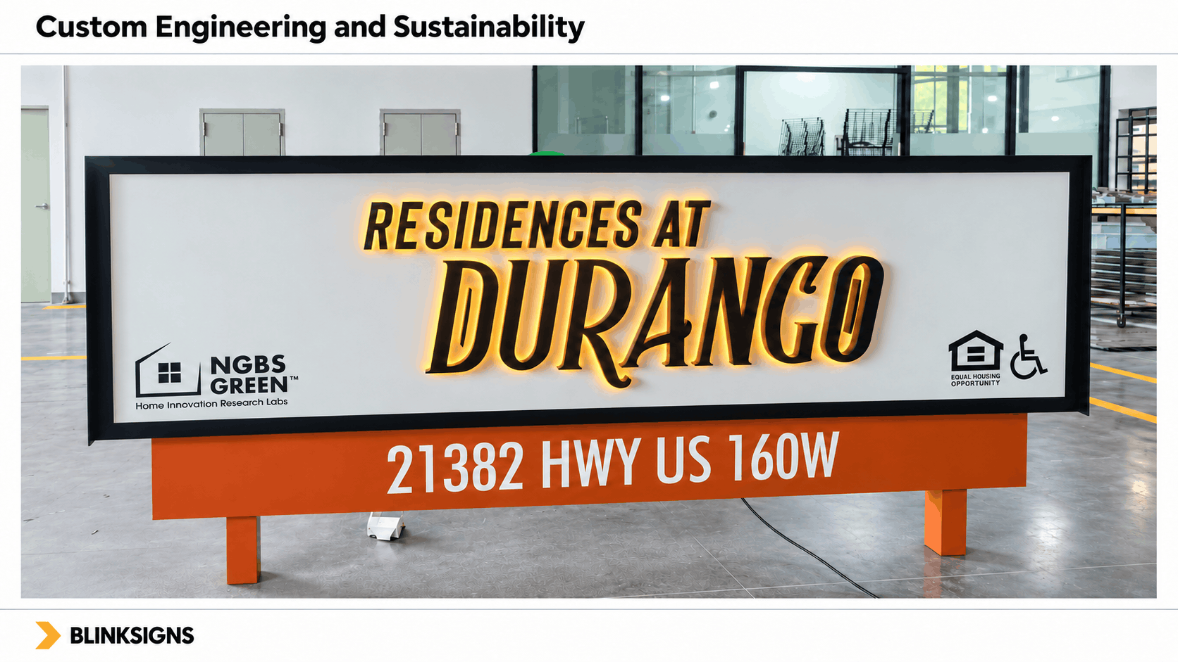 Custom illuminated halo lit Residences at Durango monument sign featuring NGBS Green certification logo in shop.